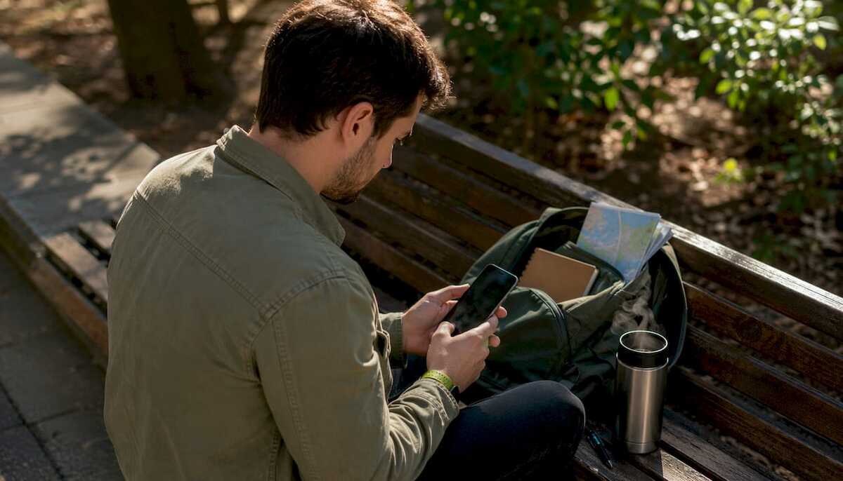 3673_Man-checking-eSIM-compatibility-on-smartphone.jpg