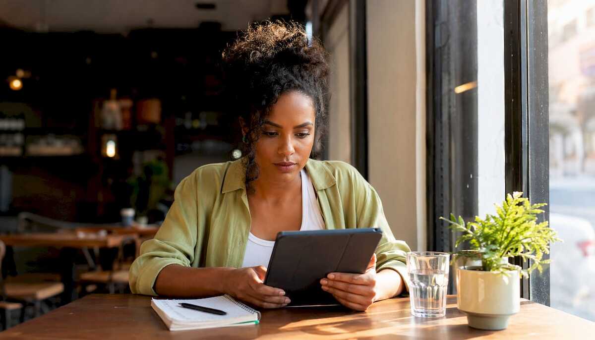5769243_Woman-selecting-travel-eSIM-plan-on-tablet.jpg
