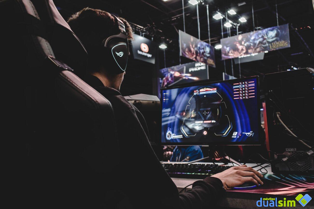 person sitting on gaming chair while playing video game